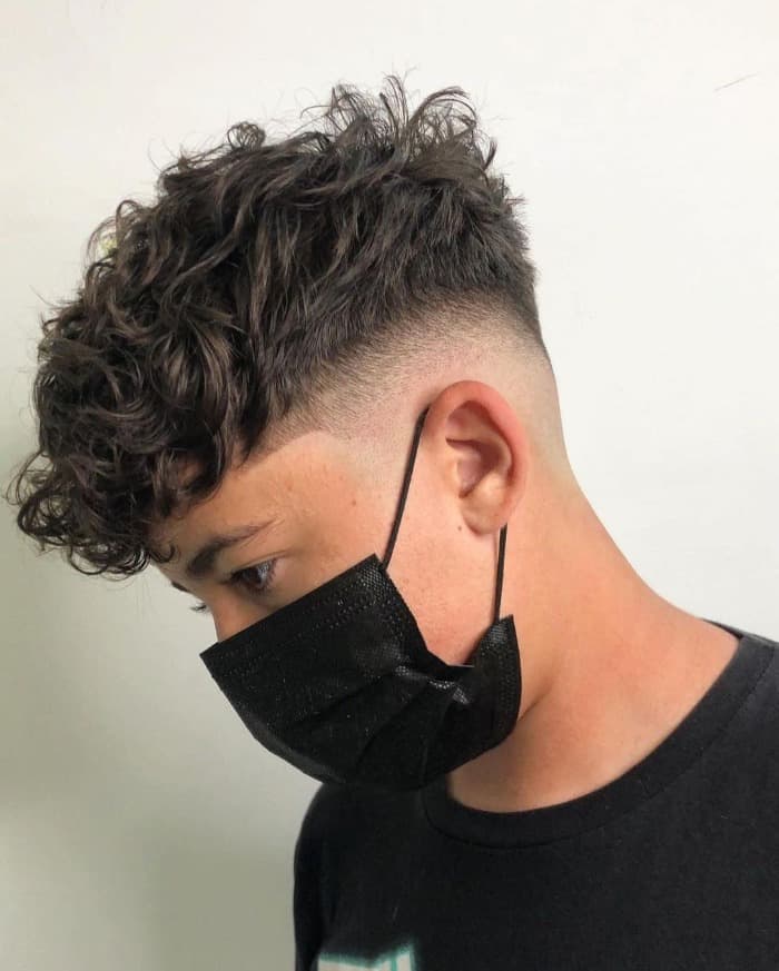 High Fade + Wavy Medium Length Men’s Hairstyle