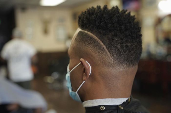 Thick Textured Hair + Razor Part on Side + Mid Fade