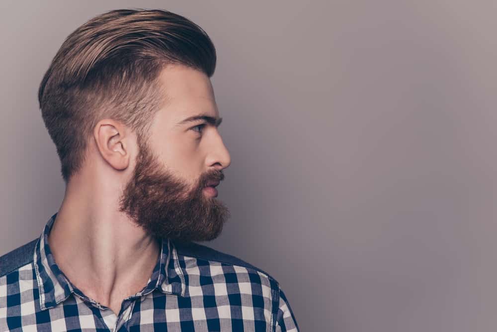 A close look at a man with healthy full beard.