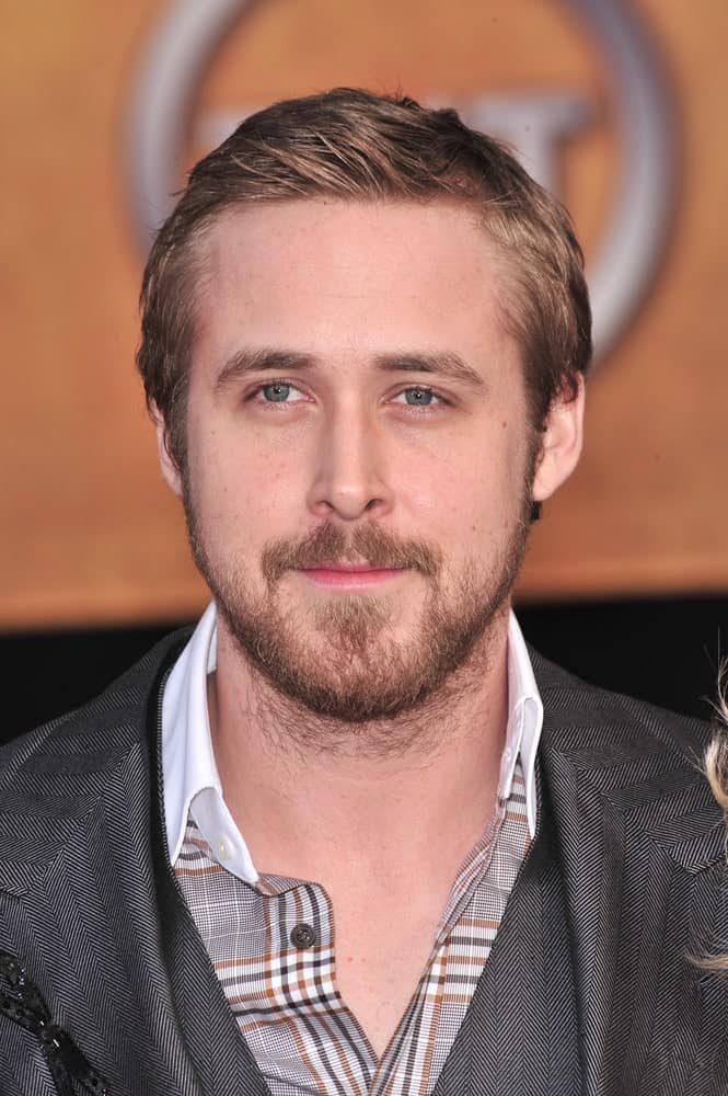 Ryan Gosling was at the 14th Annual Screen Actors Guild Awards at the Shrine Auditorium in Los Angeles on January 27, 2008. He wore a patterned gray suit with his short and spiked hairstyle.