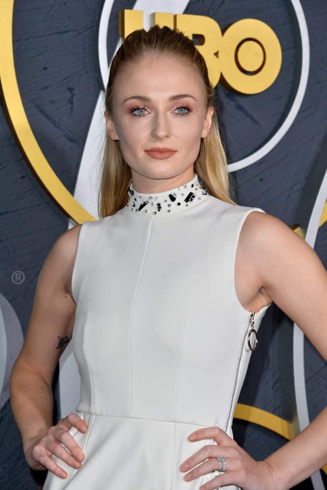 Sophie Turner struck a pose while sporting her slick half upstyle during the HBO post-Emmy Party at the Pacific Design Centre held on September 23, 2019. 