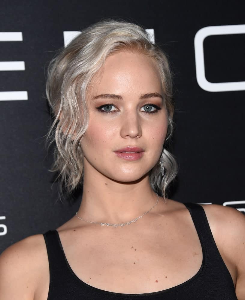 Jennifer Lawrence paired her white blond wavy ponytail hairstyle with a simple black outfit when she arrived at the Cinema Con 2016: Sony Pictures Presentation on April 12, 2016 in Las Vegas, NV.