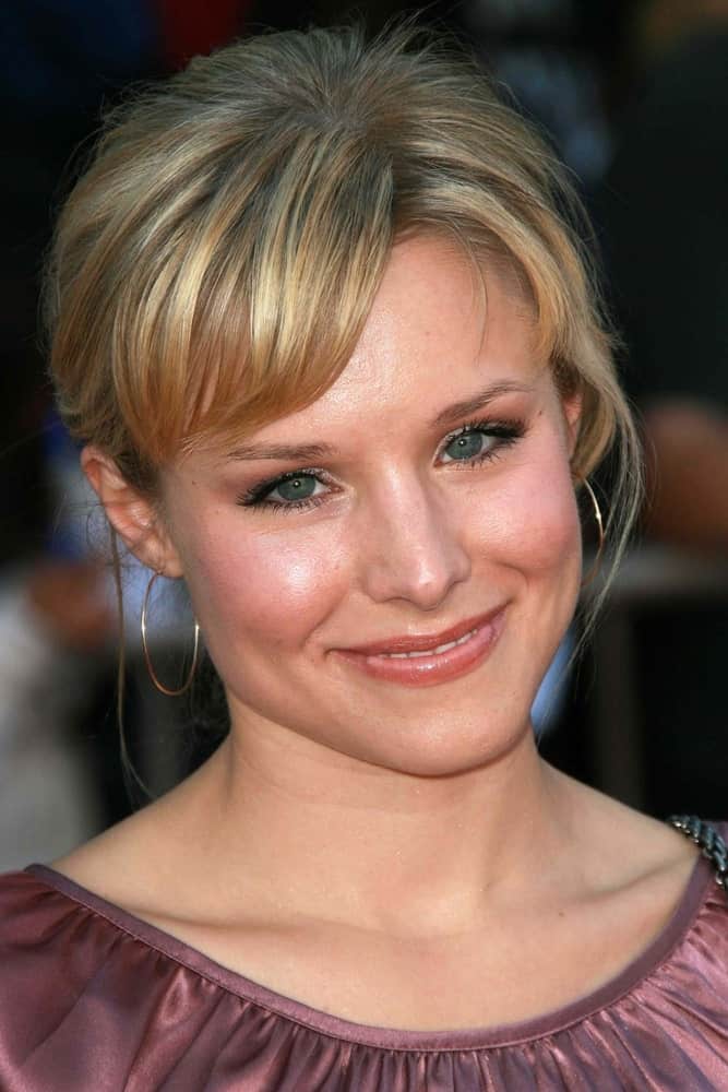 Kristen Bell exhibited a sweet aura at the world premiere of "The Game Plan" on September 23, 2007. She wore a pink dress and a messy updo with short side-swept bangs. 