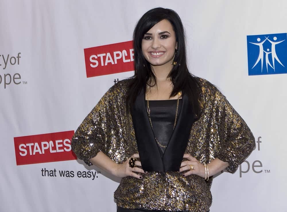 Singer Demi Lovato was at the Disney's 2nd Annual Concert For Hope at the Nokia Theatre on October 25, 2009 in Los Angeles, California. She wore a gold shimmery outfit to pair with her medium-length and straight layered raven hairstyle with side-swept bangs.