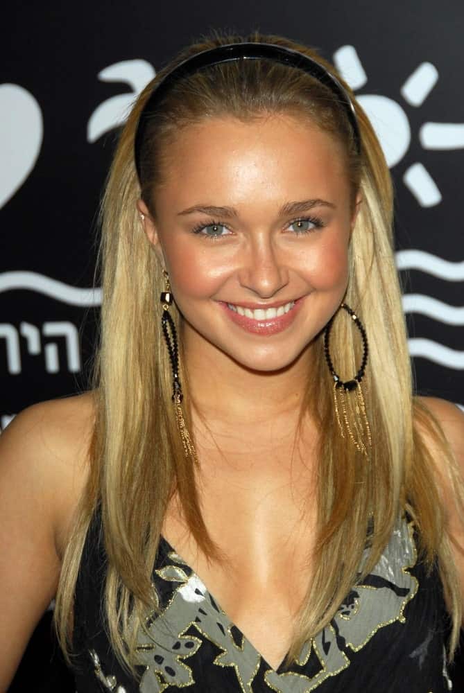 The actress sports a loose hairstyle that's slicked back by a headband. It is paired with charming boho earrings that she wore during the world premiere of "Rocky Balboa" on December 13, 2006.