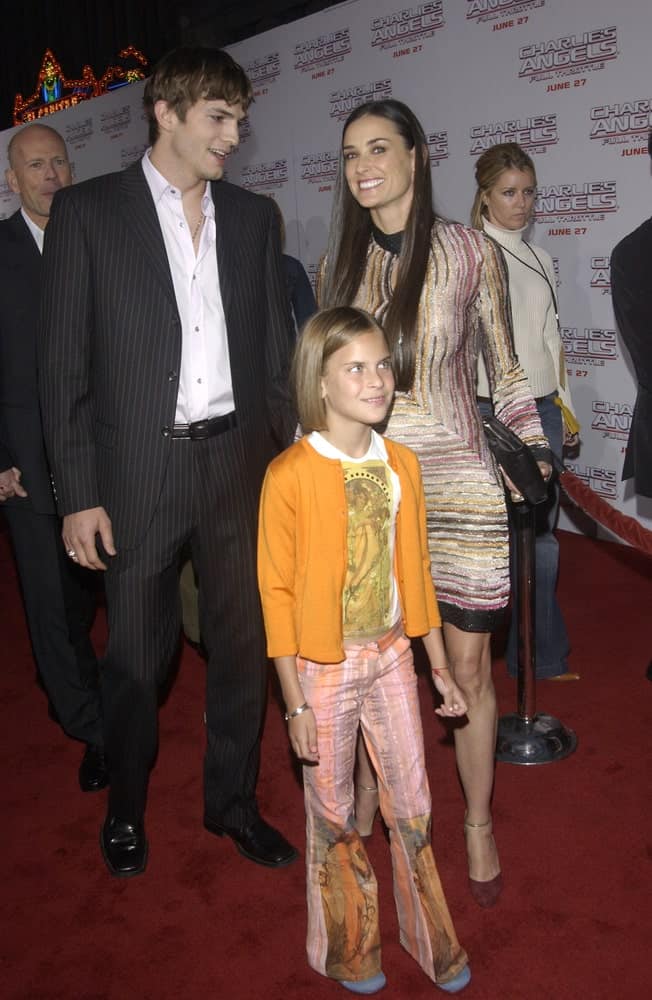 Actor Ashton Kutcher's pin-striped suit was a nice complement to his highlighted fringe hairstyle at the Hollywood premiere of Demi Moore's new movie Charlie's Angels: Full Throttle on June 18, 2003.