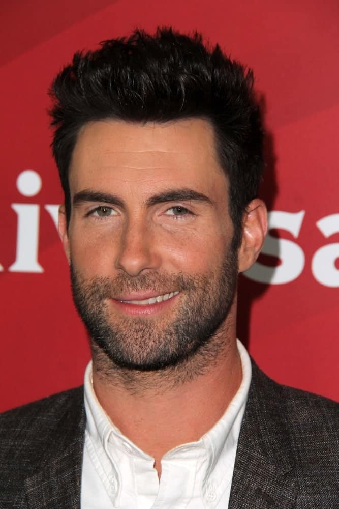 Adam Levine's sexy confident smile worked quite well with his trimmed beard and spiked fade hairstyle at the NBC Universal's "2013 Winter TCA Tour," Langham Hotel in Pasadena, CA on January 6, 2013.