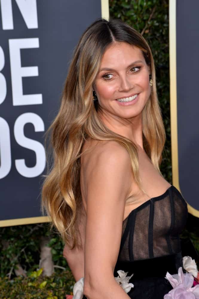 The TV personality shows off a very feminine look with a floral tube dress and a curly hair which is center-parted flowing freely to her shoulders. This was taken last January 6, 2019, during the Golden Globe Awards.