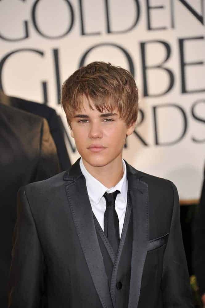 Justin Bieber styled his rounded cut at the 68th Annual Golden Globe Awards in 2011. Classic black suit completed the sophisticated look.