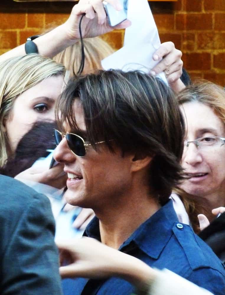 Tom Cruise at the Knight And Day Premiere back in July 22, 2010 in Leicester Square London, England. He wore a blue button-down shirt and his long flippy hair had highlights and curtain bangs.