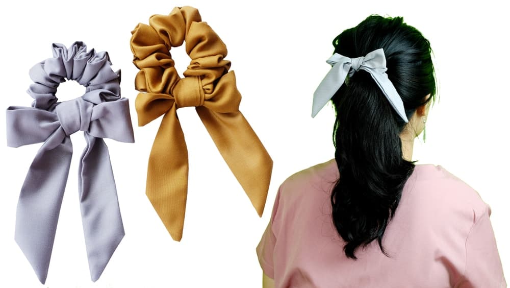 A woman wearing a bow hair tie.