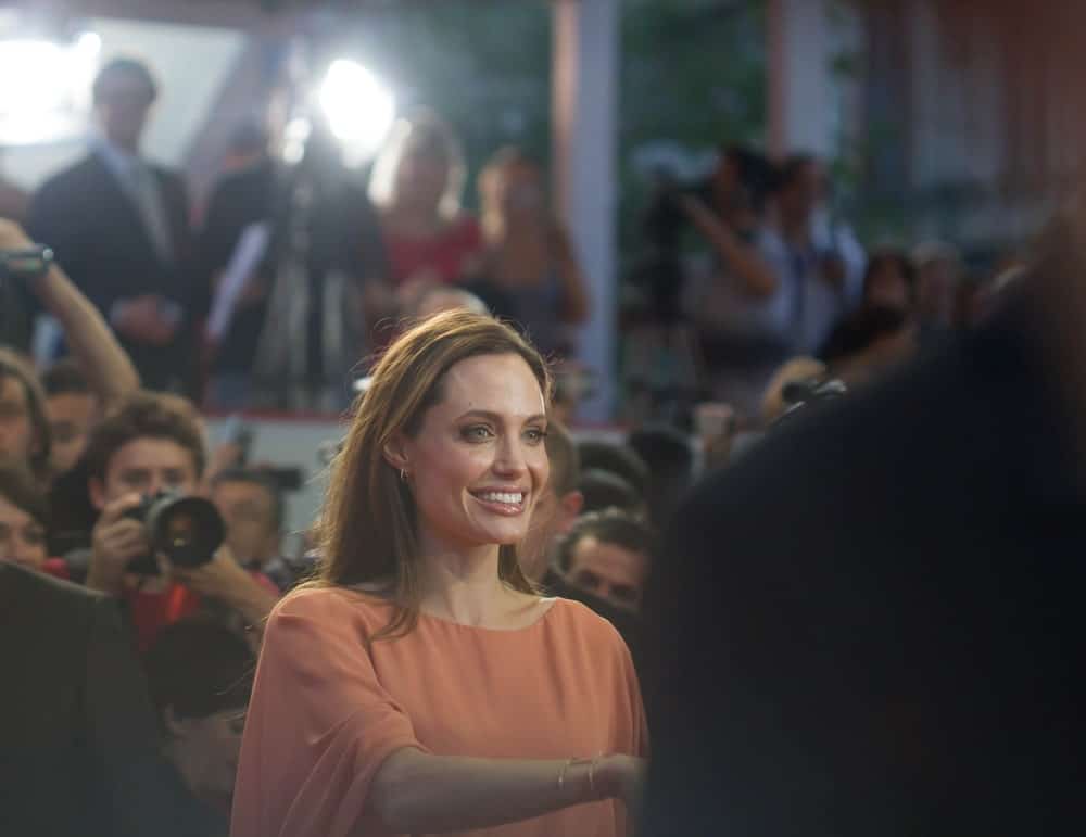 Angelina Jolie attended the closing events of the 17th Sarajevo Film Festival on July 30, 2011 in Sarajevo. She was charming in her beige dress that she paired with a brilliant smile and long loose brunette hairstyle.