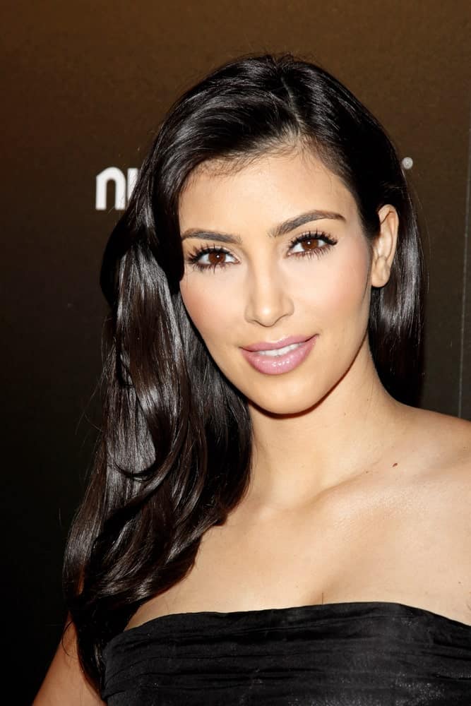 Kim Kardashian with her shiny black locks in a side-part at the party for TV Guide Magazine's Sexiest Stars held at the Sunset Tower Hotel on March 24, 2009.