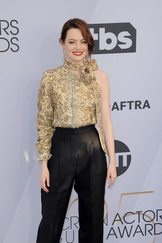 Emma Stone sported a stylish smart casual ensemble outfit with her messy bun hairstyle that has long side-swept bangs at the 25th Annual Screen Actors Guild Awards held at the Shrine Auditorium in Los Angeles on January 27, 2019.