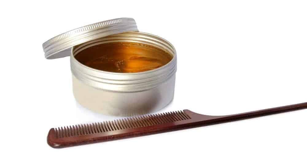 Hair pomade with a styling comb.