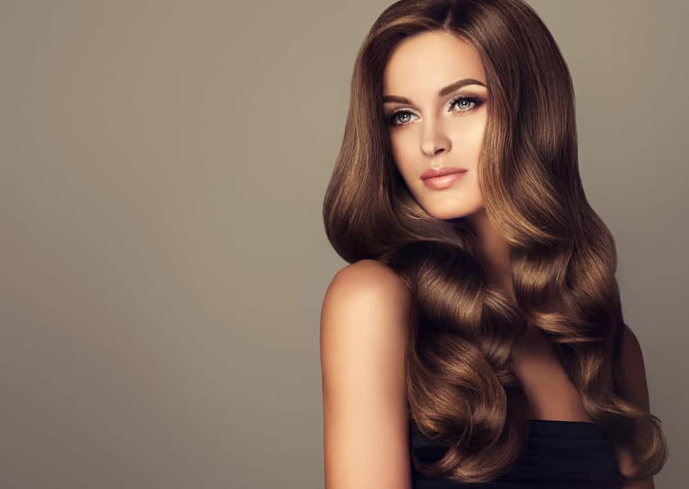 A woman with wavy brunette hair.