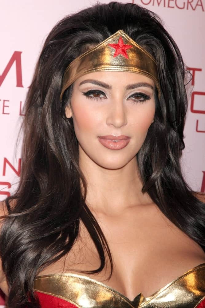 Kim Kardashian in a wonder woman costume complemented with her loose thick hair at PAMA's Halloween Masquerade at Stone Rose, Los Angeles, CA on October 30, 2008.