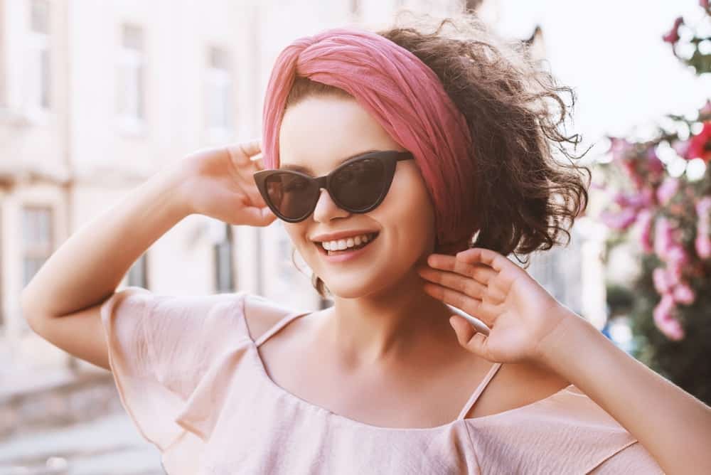 A woman wearing a cute outfit and a matching turban headband.