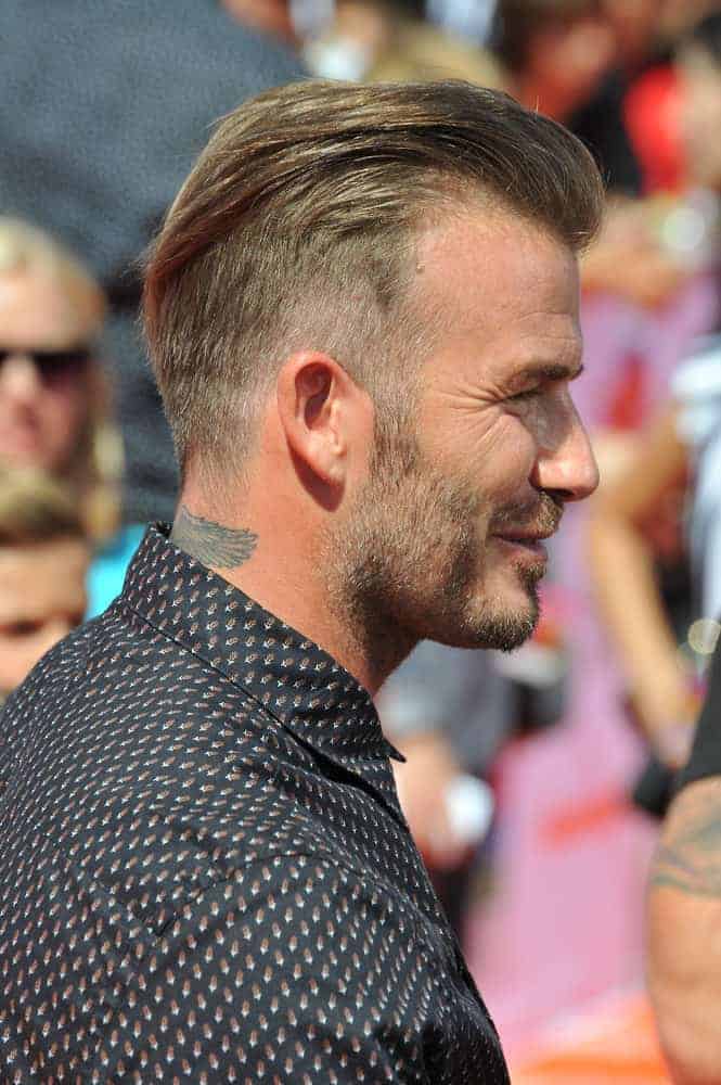 David Beckham shows the side profile of his tapered haircut at the first annual Nickelodeon Kids Choice Sports Awards at Pauley Pavilion, UCLA in 2014.