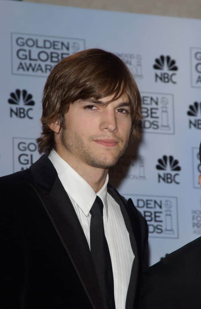 Ashton Kutcher's classy black suit was complemented by his long side-parted hairstyle and confident eyes at the 61st Annual Golden Globe Awards at the Beverly Hilton Hotel, Beverly Hills, CA on January 25, 2004.