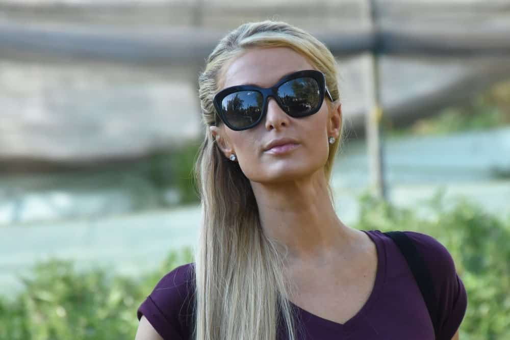 Paris Hilton was seen visiting the reconstruction of houses damaged by the 2017 earthquake on November 12, 2018 in Xochimilco, Mexico with a simple half updo hairstyle complemented with black shades and stud earrings.