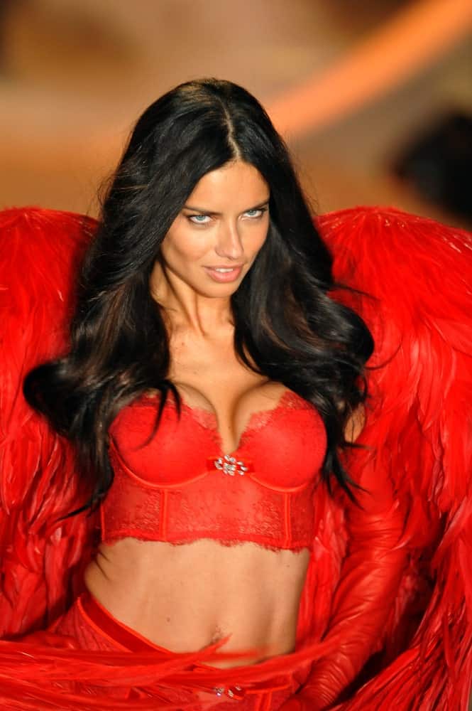 Adriana Lima walked the runway in this sexy red lingerie complemented by thick and wavy long dark hair with reddish brown highlights at the 2013 Victoria's Secret Fashion Show last November 13, 2013 in New York City.