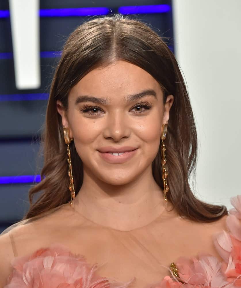 The actress looked charming in a floral pink dress with her hair center-parted which was worn during the Vanity Fair Oscar Party on February 24, 2019. Subtle waves add volume to her brunette tresses.