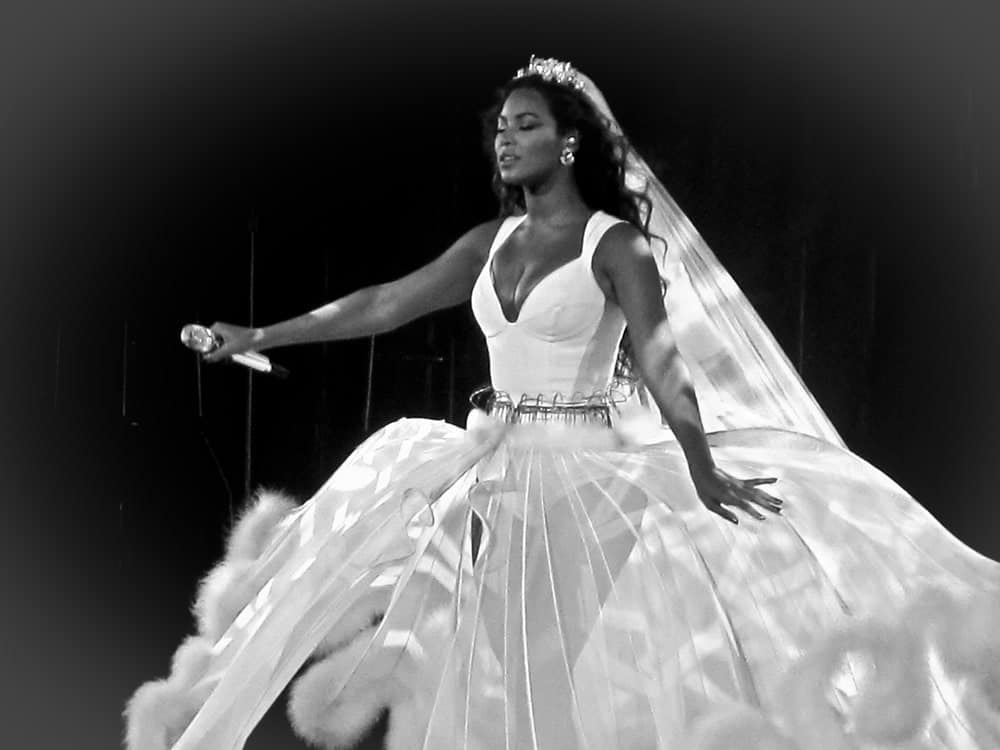 Beyonce Knowles during her show at Rod Laver Arena in Melbourne Australia on September 15, 2009, rocking a bridal gown that she contrasts with her dark long waves.