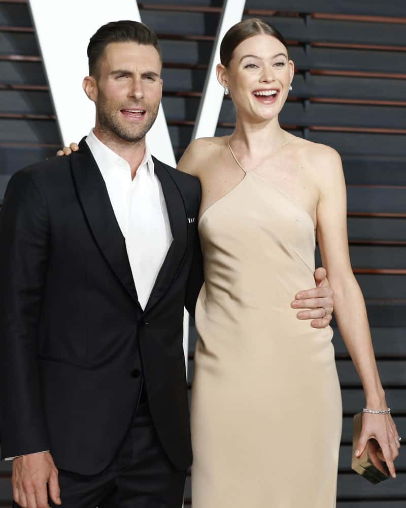 Adam Levine and Behati Prinsloo were at the Vanity Fair Oscar Party on February 22, 2015 in Beverly Hills, CA. Levine looked classy with his black suit and slick side-swept pompadour fade hairstyle.