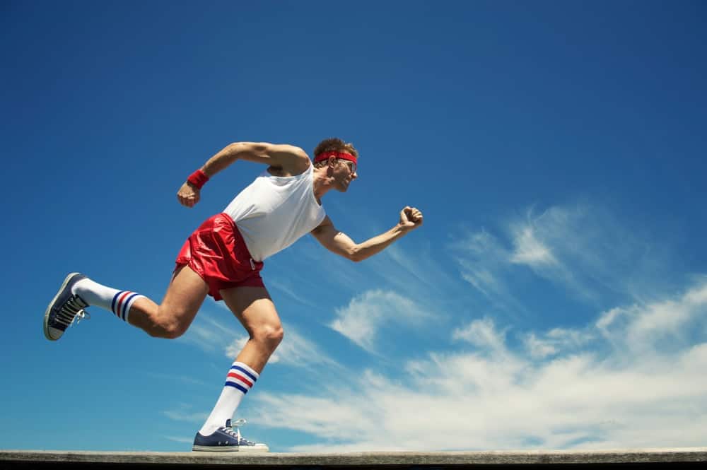 A man wearing a red runner's headband.