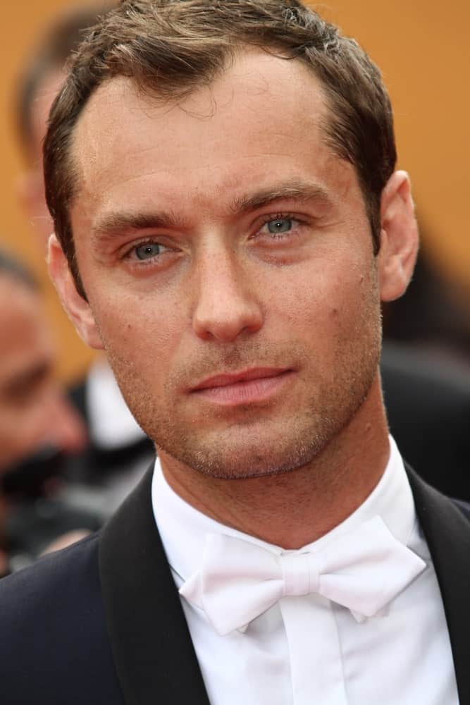 Jude Law looked elegant with his white bow tie and short spiky dark brown hair at the 'Pirates of the Caribbean: On Stranger Tides' premiere at the Palais des Festivals last May 14, 2011 in Cannes, France.