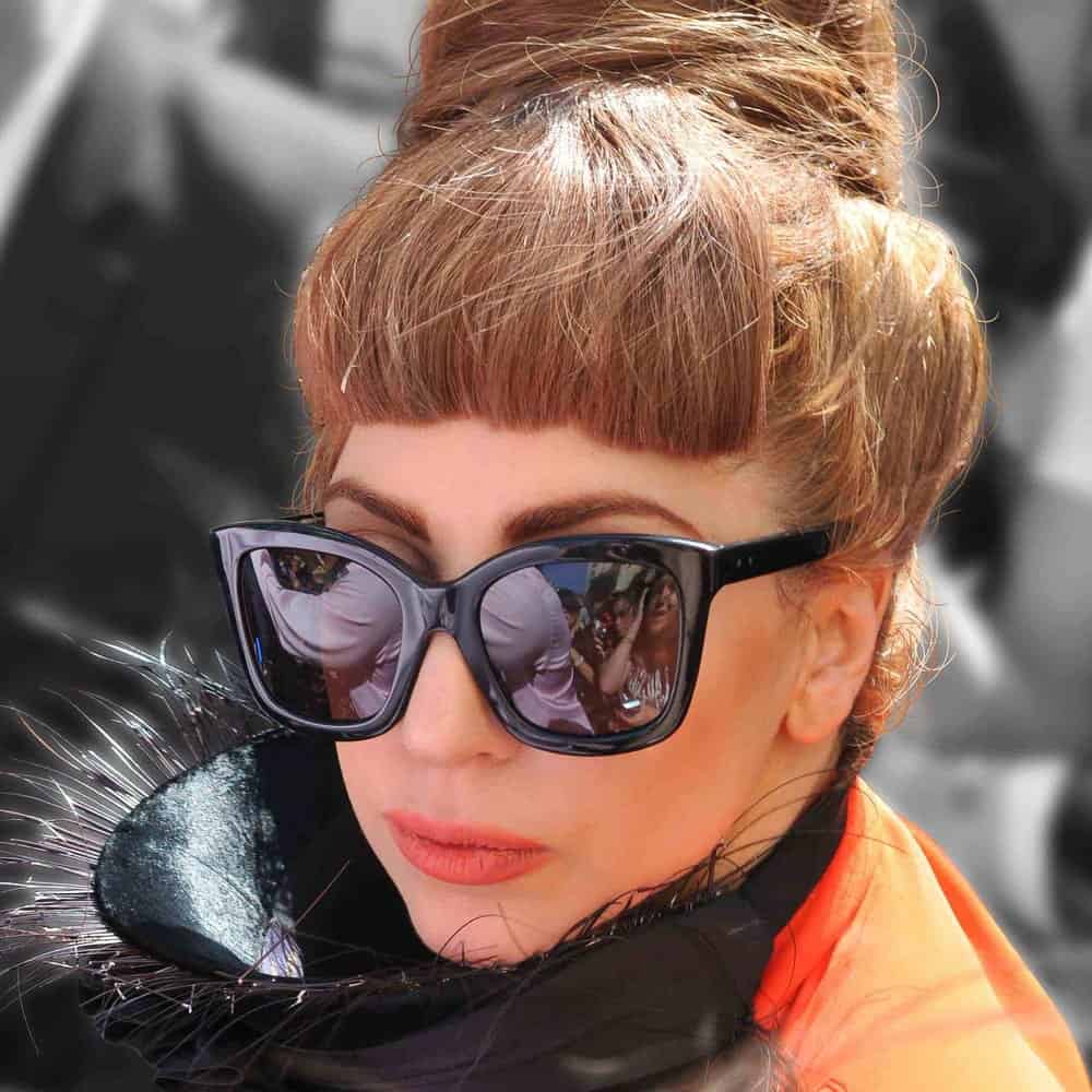 Lady Gaga was seen outside a London hotel in London on September 9, 2012. She was lovely with her cool sunglasses, gorgeous make-up and a tall beehive style top knot bun with a dark brown tone.