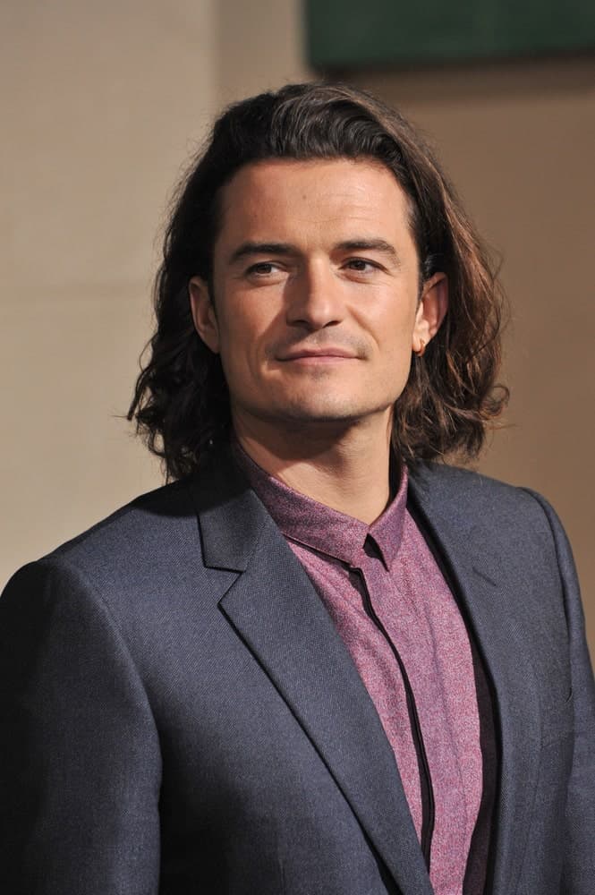 Orlando Bloom paired his smart casual outfit with a long and side-swept hairstyle with highlights at the 2014 Los Angeles premiere of his movie "The Hobbit: The Battle of the Five Armies" at the Dolby Theatre, Hollywood.