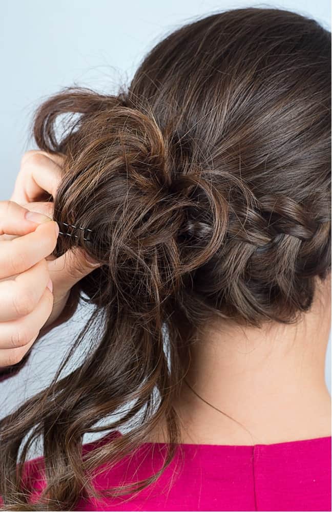 Step 7: Tuck and pin the ends of your side ponytail back into the loop