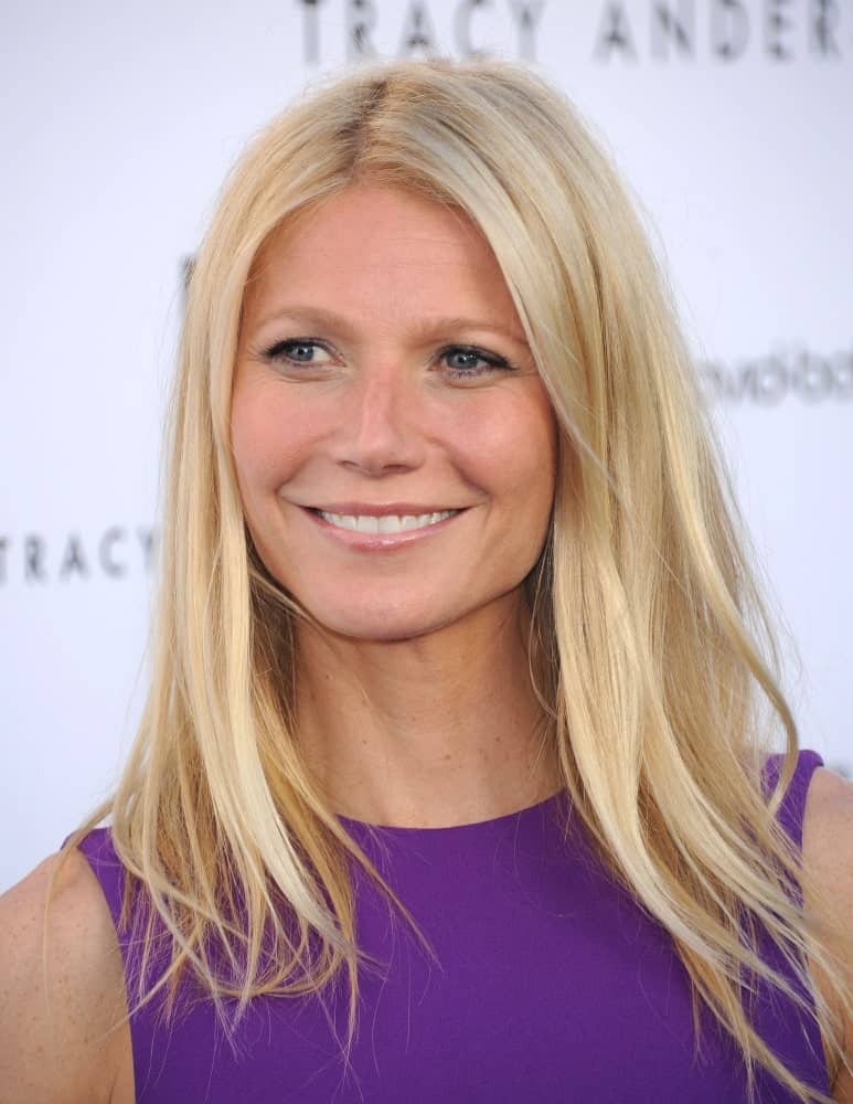 Gwyneth Paltrow was seen at the Tracy Anderson Flagship Studio Opening on April 04, 2013 in a bold purple dress and a slightly tousled hairstyle with middle parting.