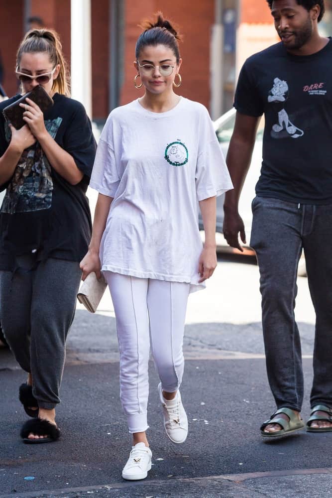 Selena Gomez was seen exiting her hotel on September 4, 2017 in New York City. She was walking in her casual clothes with a lovely messy bun hairstyle.