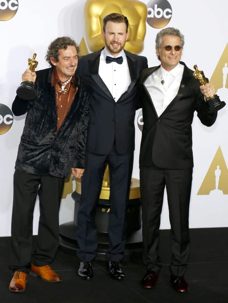 Mark Mangini, David White and Chris Evans posed for a photo at the 88th Annual Academy Awards in Hollywood on February 28, 2016. Evans was quite dapper in his black tux and slick pompadour hairstyle.