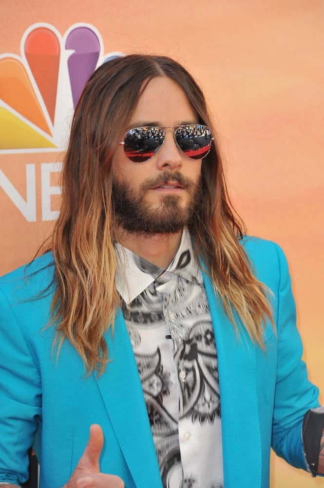 The singer exhibited a cool look in a blue suit along with his long tousled hair incorporated with a stubble beard. This was taken at the 2014 iHeartRadio Music Awards held on May 1st.