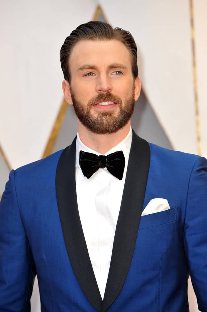 Chris Evans sported a side-parted slick pompadour look to go with his classy blue tux at the 89th Annual Academy Awards held at the Hollywood and Highland Center in Hollywood on February 26, 2017.