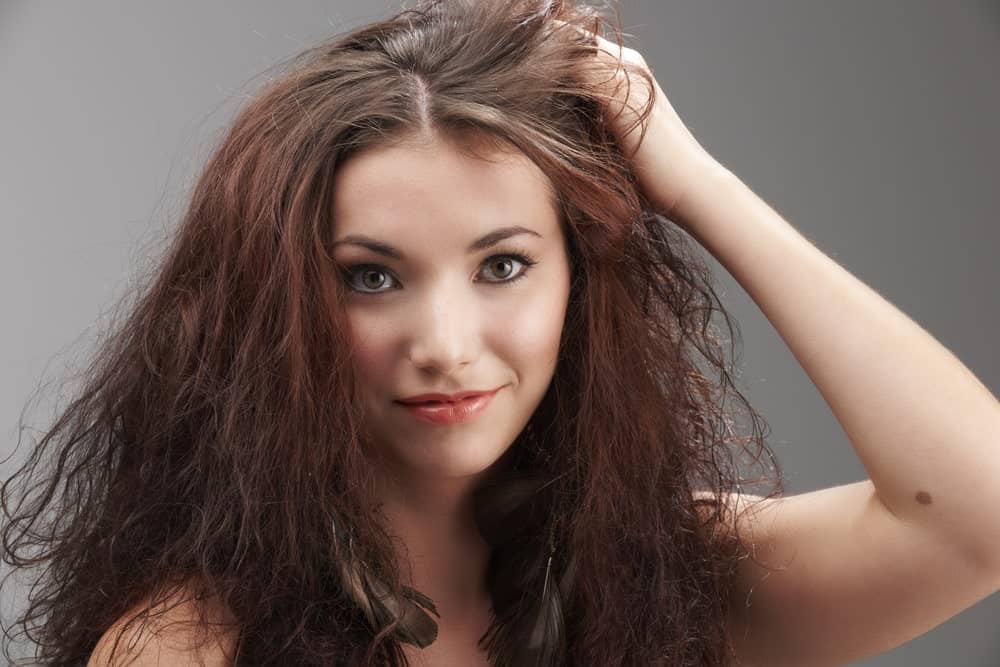 Women grabbing her frizzy hair