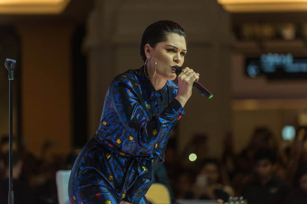 Jessie J. performed at the Dubai Shopping Festival Fashion Show in Mall Of The Emirates on the 20th of January 2017. She rocked the stage with a colorful romper to match her stylish slicked-back pixie hair.