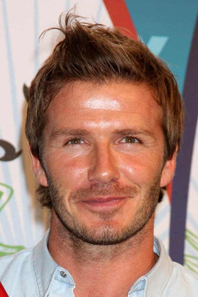 David Beckham styled his elongated hair with an outgrown temple and nape haircut as well as some quiff at the front during the 2010 Teen Choice Awards at Gibson Ampitheater at Universal on August 8, 2010 in Los Angeles, CA.