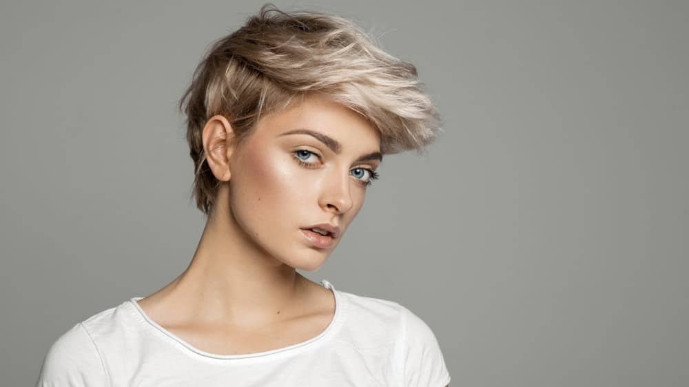 A woman sporting short balayage hairstyle.