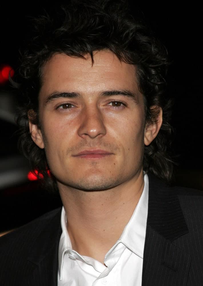 Orlando Bloom was gorgeous in his black suit and his messy tousled curly hairstyle with spikes at the Global Green USA Pre-Oscar Celebration to Benefit Global Warming held at the Avalon in Hollywood on February 21, 2007.