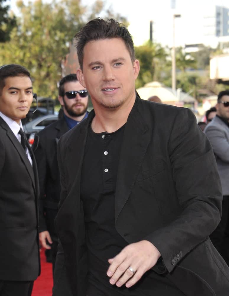 Channing Tatum rocked a messy pompadour hairstyle complemented with an all black top during the 2014 MTV Movie Awards at the Nokia Theatre LA Live on April 13, 2014.