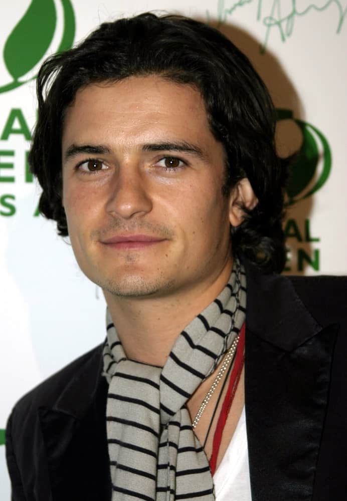 Orlando Bloom attended the Global Green Pre-Oscar Party held at the Day After Club in Hollywood, California on February 24, 2005. He wore a fashion-forward scarf that went well with his long dark curls.