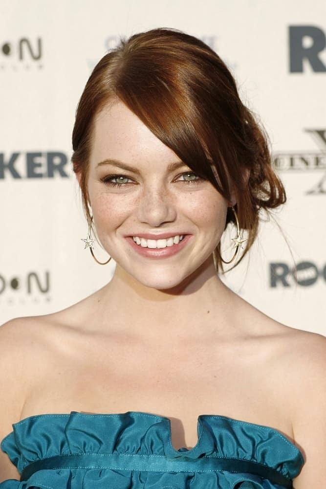 A young Emma Stone attended THE ROCKER Opening Night Premiere of CineVegas 2008 held at the Palms Casino Resort in Las Vegas, NV on June 12, 2008. She wore a blue dress to pair with her loose low bun hairstyle with long side-swept bangs.