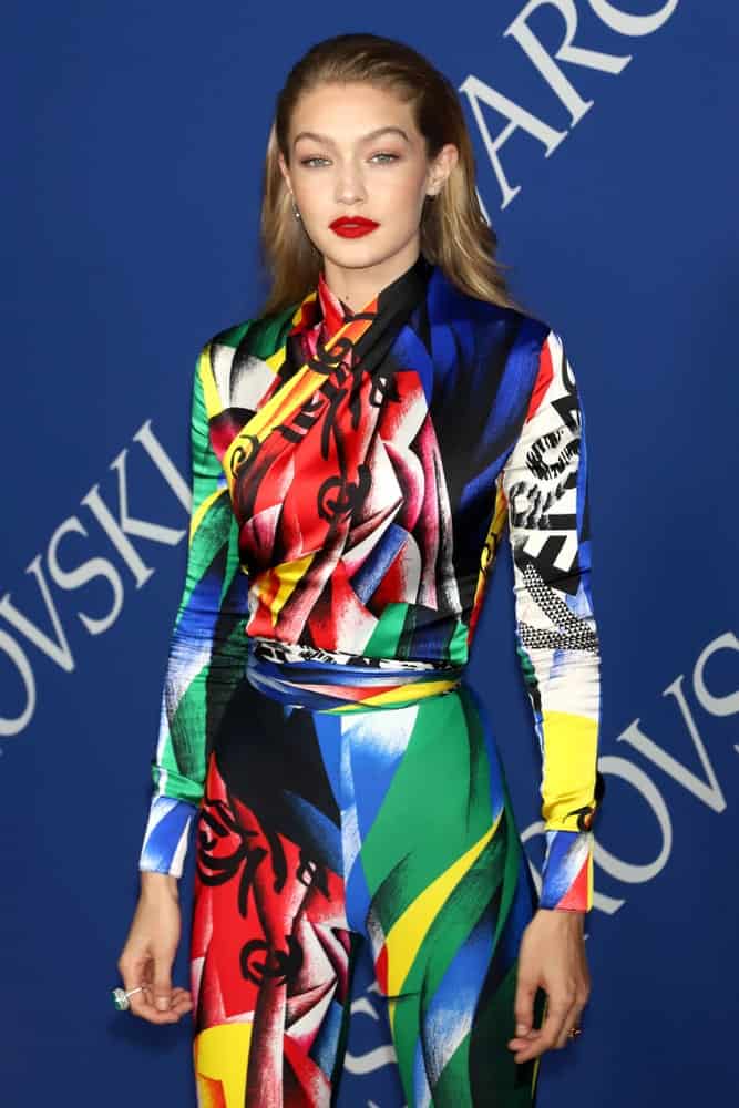 Gigi Hadid wowed everyone with her colorful dress and classy slick half up hairstyle when she attended the CFDA Awards at the Brooklyn Museum on June 4, 2018, in New York.