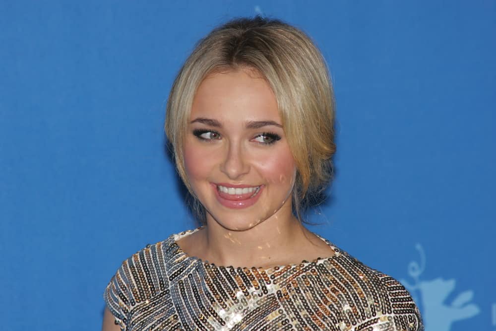 The actress arrives for the 'Fireflies In The Garden' Photocall as part of the 58th Berlinale Film Festival on February 10, 2008, with a messy updo that's center-parted showing some outgrown hair.