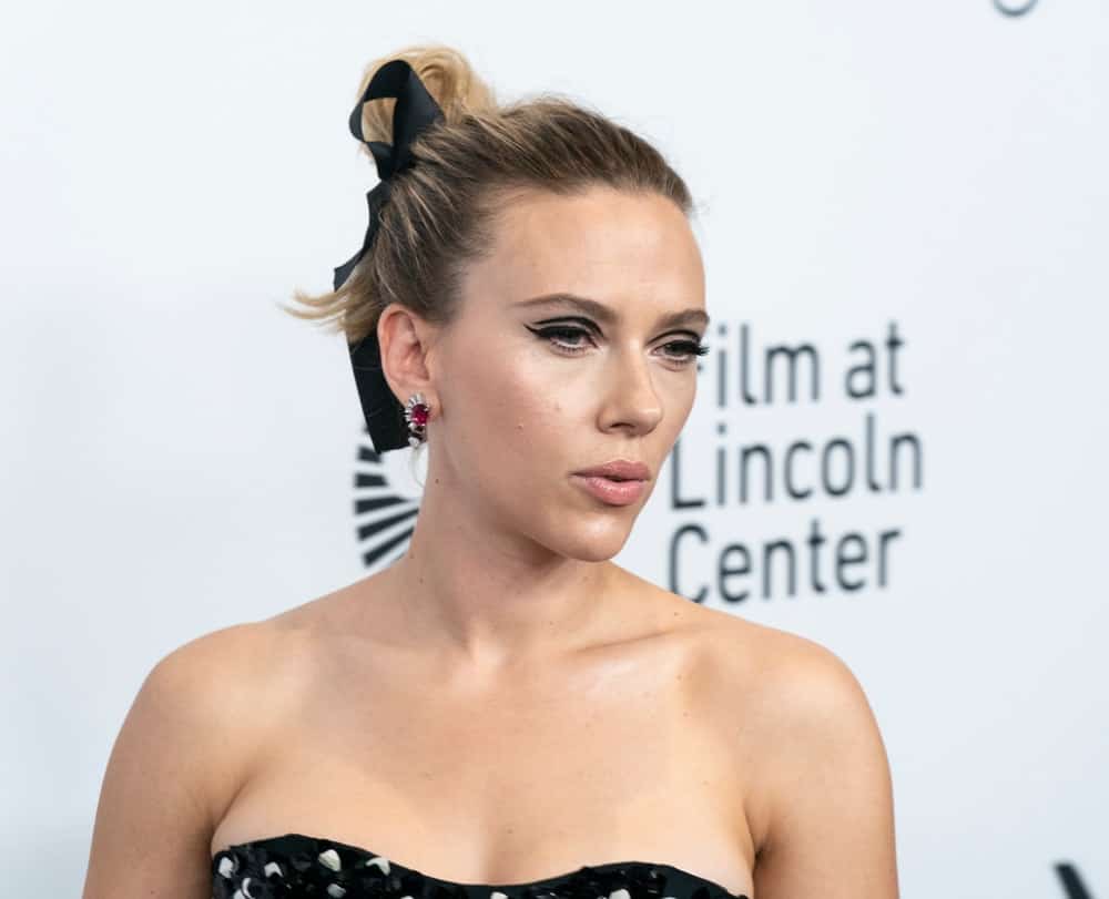 On October 4, 2019, Scarlett Johansson wore a black strapless dress by Dior at the premiere of "Marriage Story" at the 57th New York Film Festival at Lincoln Center Alice Tully Hall. She paired this with a classy highlighted high bun hairstyle with a black bow.